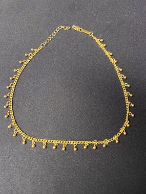 Dangling dotted choker necklace by Nominal